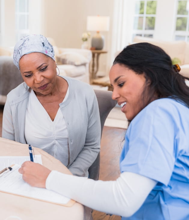 Post hospital home care Johnson County caregiver assisting senior at home