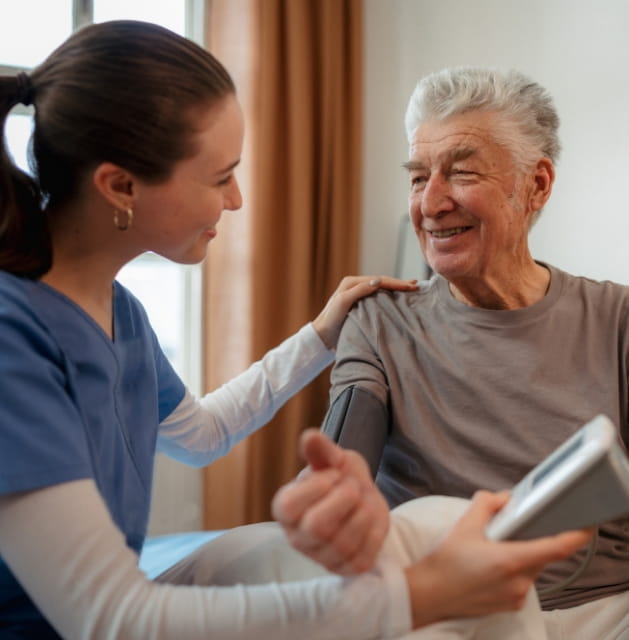 Professional caregiver providing respectful in-home care for a senior veteran