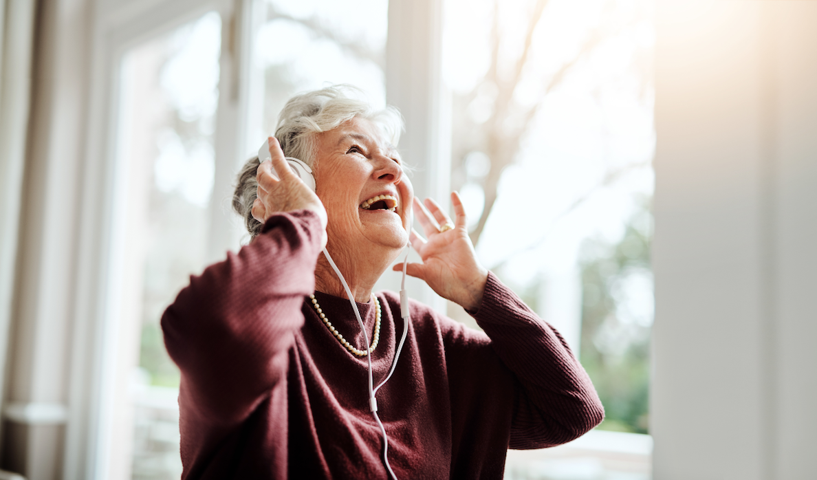 Senior Citizen Woman Listening to Music on sunny day in Milwaukee County