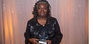 A photo of Shirley Norwood holding her award.