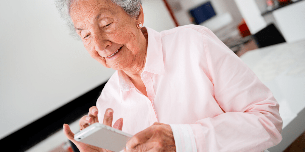 An older lady on her smart phone.