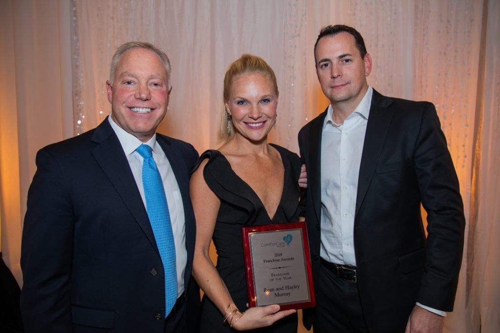 A photo of the Murrays receiving the 2018 Franchise of the Year award.